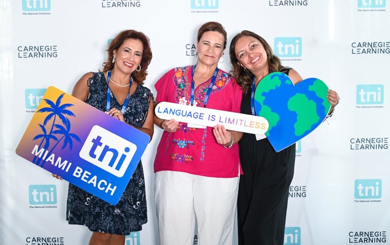 The National Institutes educator attendees smiling and holding signs