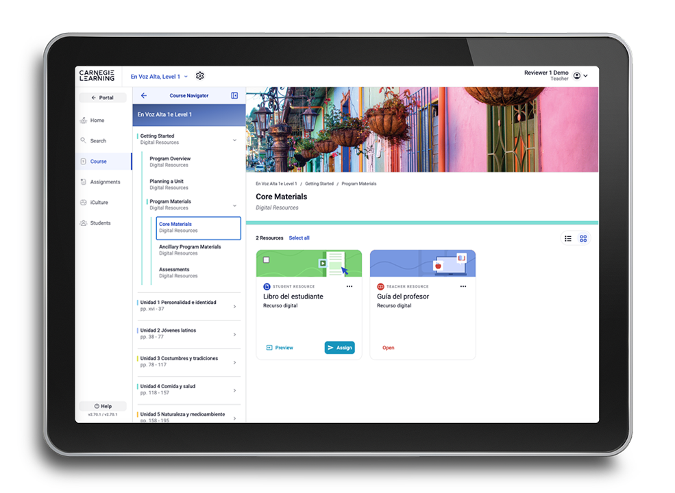 A tablet displaying a content library for Spanish language learning materials showing book covers for various levels of 