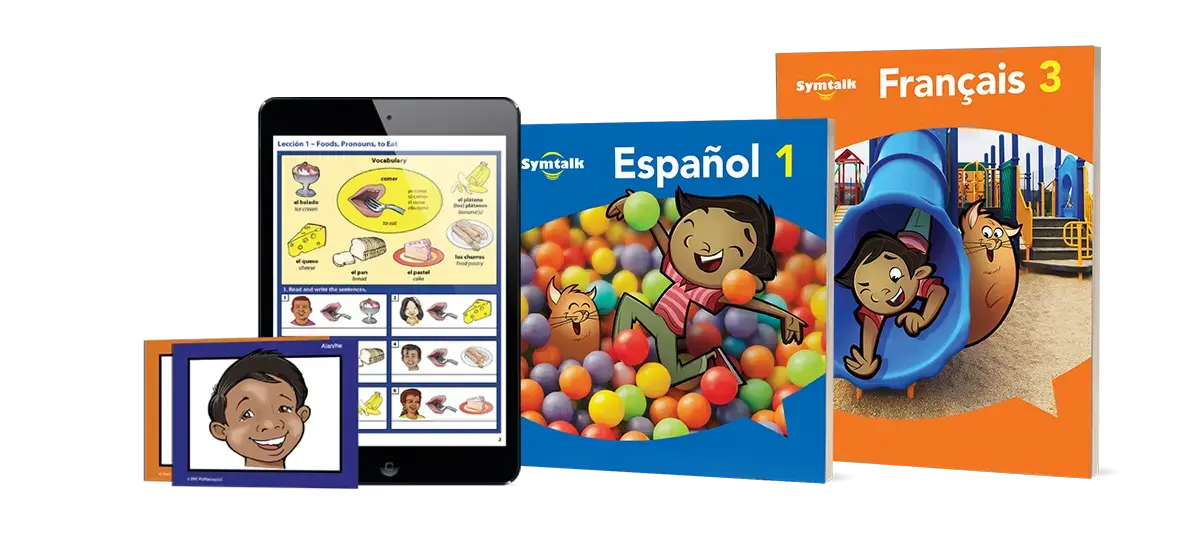 A display of Symtalk visual language learning materials including an illustrated textbook for Español 1 with a child and cat in a ball pit, a Français 3 book with a child on a slide, and language flashcards on a tablet and card showing vocabulary.